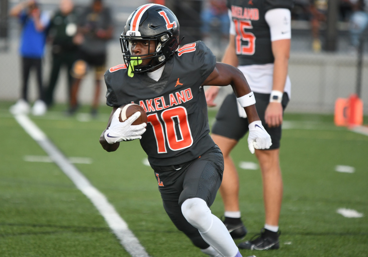 Lakeland running back Rick Penick takes off on a run during a 30-2 win against Bartow at Bryant Stadium Friday. Penick would score on a 5-yard reception later in the game.